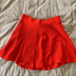 Red quilted mini skirt